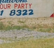 Gorilla Playing Saxophone With Balloons Sign